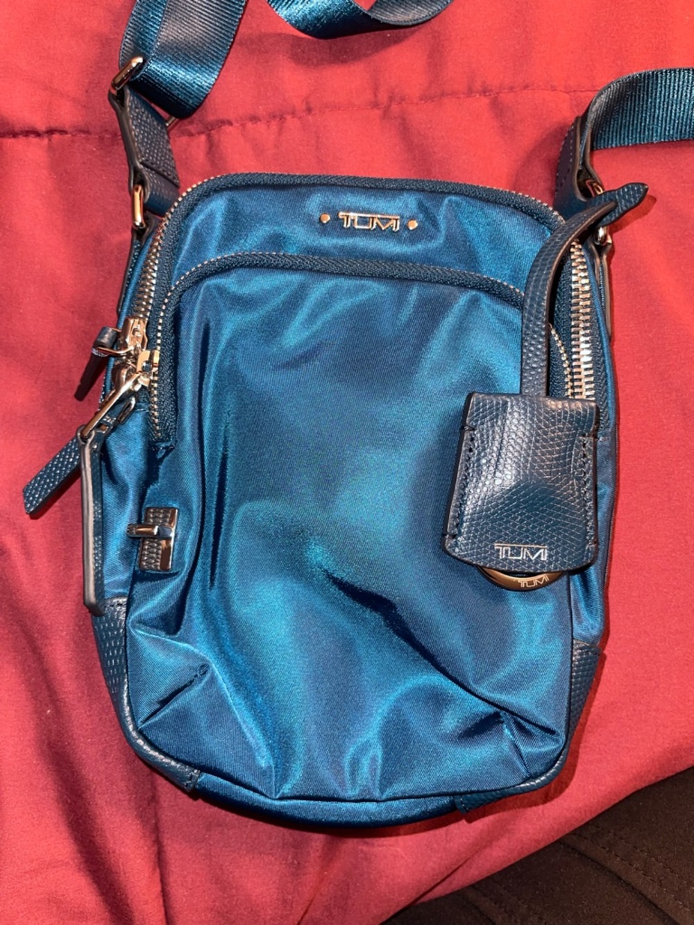 Tumi Ruma Navy Crossbody Bag with Gold Accent